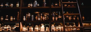 Pharmacy shelves lined with medicine jars and a wooden ladder